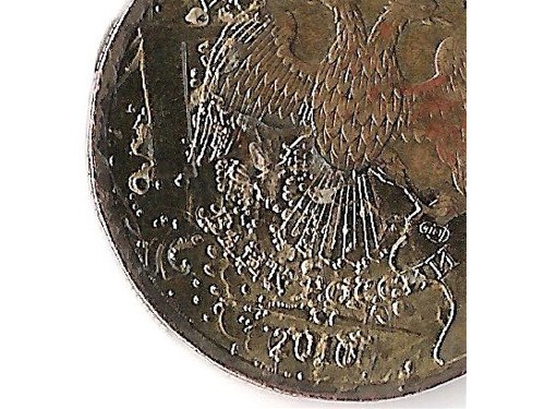 Монета 10 рублей 2010 года Клей или лак на монете