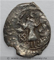 Монета Денга (человек с саблей вправо и тамга, на обороте надпись). Аверс